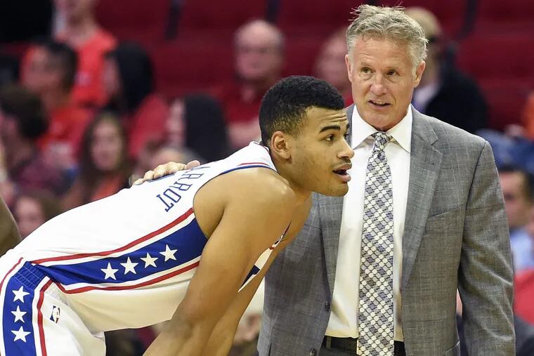 Sixers coach Brett Brown talks with Timothe Luwawu-Cabarrot.