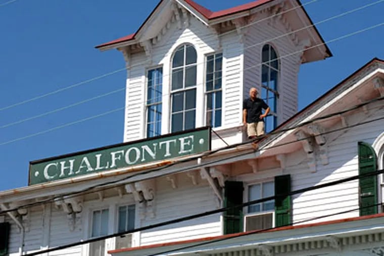 Bob Mullock, the new owner of the Chalfonte Hotel in Cape May, poses on the roof next to the cupola. The hotel changed hands for only the third time in its 132 year history. (Tom Gralish/Inquirer)