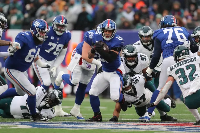 New York Giants running back Saquon Barkley runs for a first down against the Eagles in the second quarter at Metlife Stadium in East Rutherford, New Jersey on Sunday, December 11, 2022.