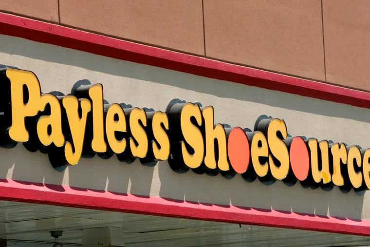 FILE- This Aug. 23, 2006, file photo shows a Payless store front in Philadelphia. Paylesss ShoeSource is shuttering all of its 2,100 remaining stores in the U.S. and Puerto Rico, joining a list of iconic names like Toys R Us and Bon-Ton that have been shuttered in the last year. The Topeka, Kansas-based chain said Friday, Feb. 15, 2019, it will hold liquidation sales starting Sunday and wind down its e-commerce operations.