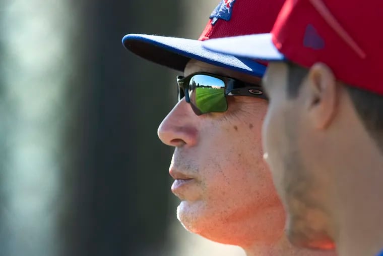 Phillies manager Joe Girardi  watching drills Tuesday in Clearwater, Fla.