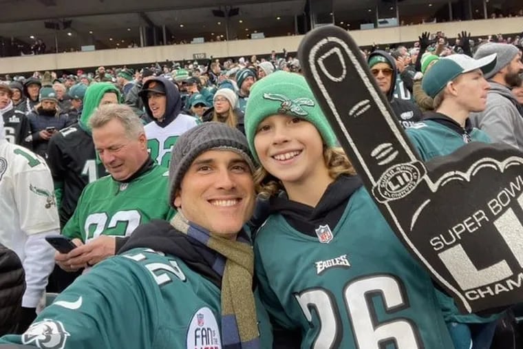 The author and his son at a recent Eagles game.