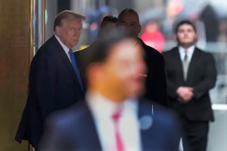 Former president Donald Trump leaves Trump Tower on his way to Manhattan criminal court on Thursday in New York.