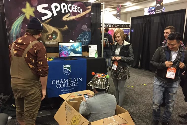 Student developers from  Champlain College showcasing Spacebox, an alternative-controller game, last year in San Francisco.