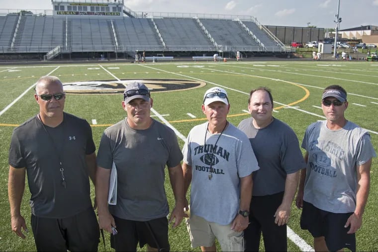 Harry S. Truman head coach Mike LaPalambora (center) and his assistants who were together at Pennsbury pose at the Truman field August 22, 2017. From left to right are: Dave Sanderson, Galen Snyder, Mike LaPalambora, Keith Rieser and Jeff Arndt. TOM GRALISH / Staff Photographer