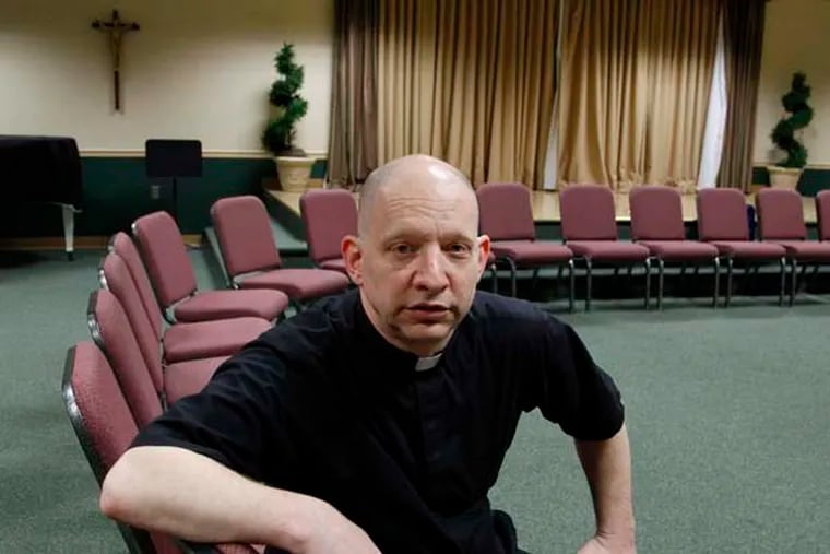 Father John Stabeno poses before a meeting at St. Charles Borromeo in Sicklerville,NJ.  A Washington Township , Father John Stabeno, priest's plans to operate a sober-living facility for recovering male addicts has concerned neighbors in the township - and the church. The diocese, he says, is not allowing him to be the face for the project and he is now looking for a third-party organization to carry out the plan. on Monday, April 14, 2014. ( RON CORTES / Staff Photographer )