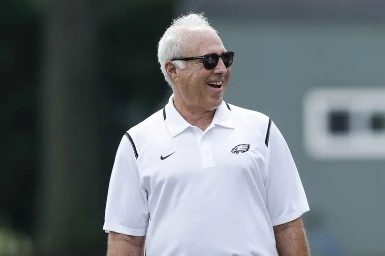 Eagles Chairman and Chief Executive Officer Jeffrey Lurie smiles while watching team practice at the NovaCare Complex of Thursday,