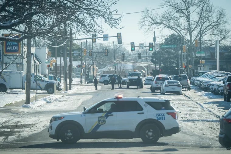 Police at the scene, near the 7800 block of Roosevelt Boulevard, where a man in his 70s was shot and killed by police after officers said he shot at them early Wednesday morning.