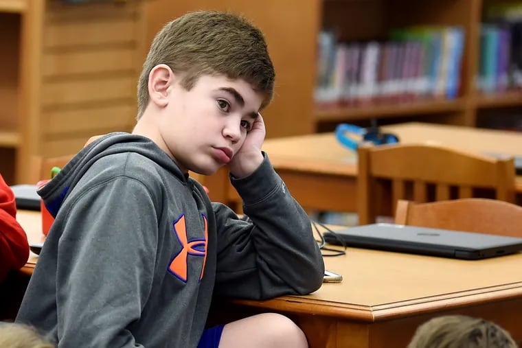 Connor Dobbyn in a classroom at West Vincent Elementary School in Chester Springs in February 2020, before the pandemic struck. Eight months later, efforts are back on track to raise funds to reverse his life-shortening "Childhood Alzheimer's."