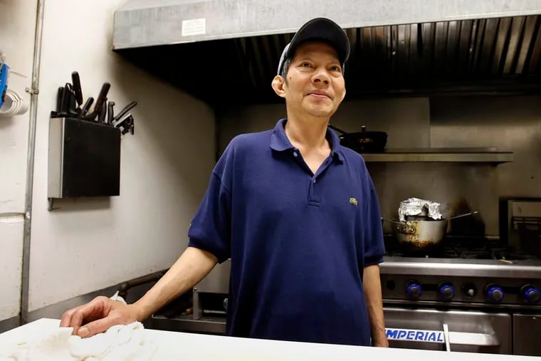Quang Dao stands in the kitchen at Tangier on Sunday, August 3, 2014.  Dao, a Vietnamese cook, has been at Tangier for the last 28 years.