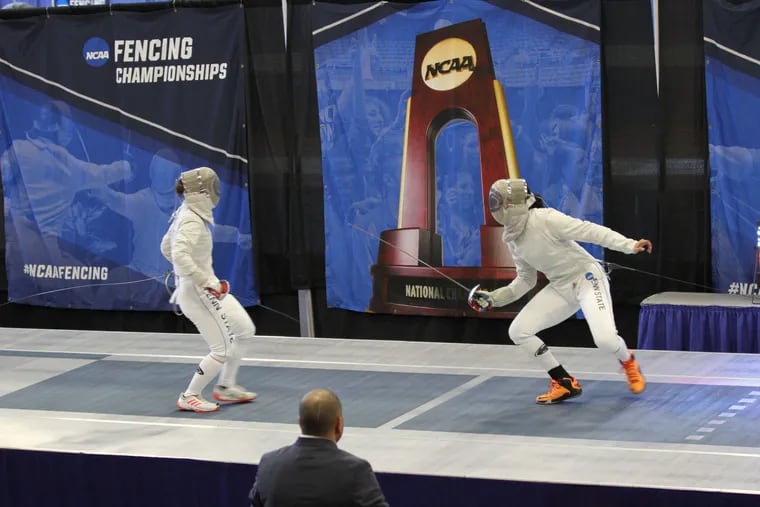 Fencer Zara Moss (right) competes.