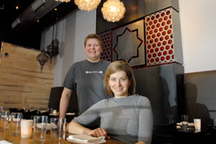 Marcie Turney (left), Valerie Safran at their Bindi Restaurant, a new upscale Indian BYOB between their market, Grocery, and furnishings shop, Open House, and across from their Mexican spot.