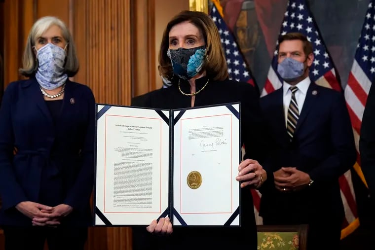 House Speaker Nancy Pelosi of Calif., displayed the signed article of impeachment against President Donald Trump in an engrossment ceremony before transmission to the Senate for trial on Capitol Hill.