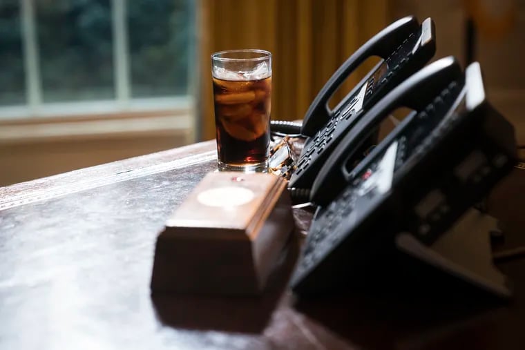 A glass of soda is seen on the desk as President Donald Trump speaks during a meeting in February 2018.