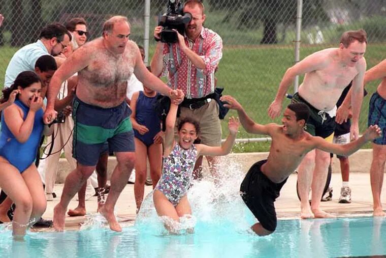 During his tenure as mayor, Ed Rendell gathered a group of children together to inaugurate the reopening of a swimming pool in Hunting Park. Also on hand was the city’s police commissioner, John Timoney (right).