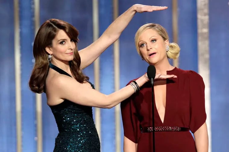 Co-hosts Tina Fey and Amy Poehler at the 70th Golden Globes. (AP Photo)