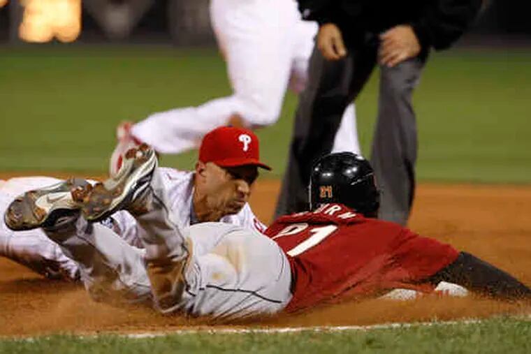 In the 15th inning of Tuesday's game, Raul Ibanez beats Houston baserunner Michael Bourn to first base. Ibanez was replacing the ejecetd Ryan Howard at first.