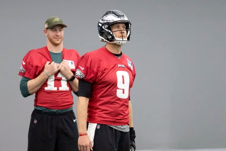 Carson Wentz, sidelined down the stretch by injury for a second straight season, watching steady Nick Foles run the team at practice last month.