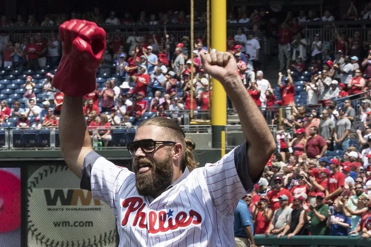 Former Phillies outfielder Jayson Werth raises his arms after being introduced Sunday during the 10-year reunion of the Phillies' 2008 World Series team at Citizens Bank Park.<br/>
.