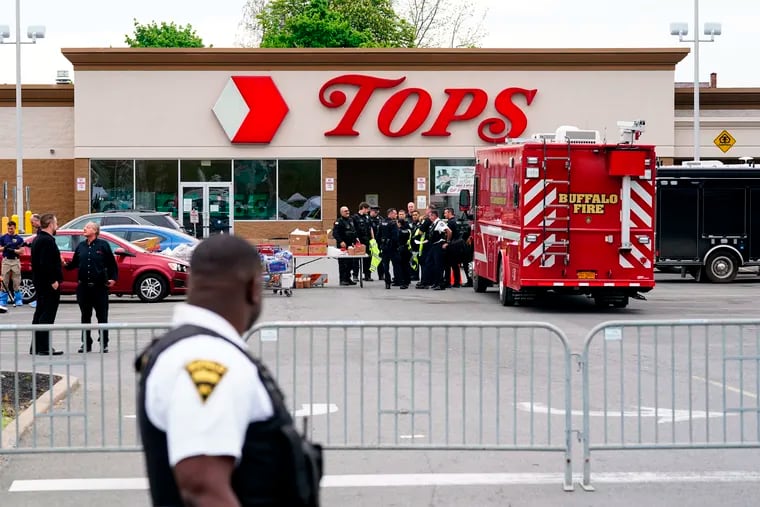 Investigators at the scene of a shooting at a supermarket in Buffalo, N.Y., on Monday.