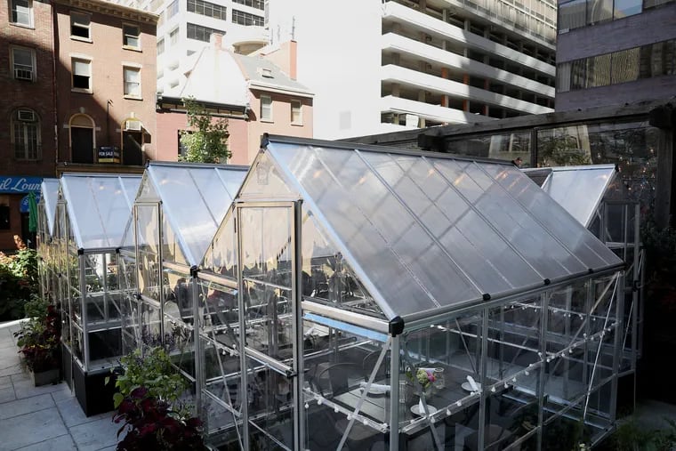 Mini greenhouses are set up for isolated seating as the weather cools at Harper's Garden in Center City on Oct. 8, 2020.