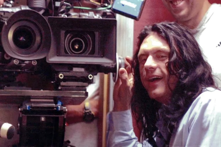 Tommy Wiseau and his two-camera setup. Wiseau's "The Room," is a bizarre cult classic that turns 20 this year. Philadelphia's love for the film is old and growing.