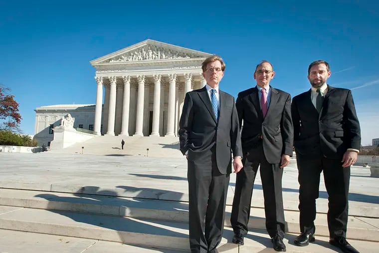 John Elwood (L), lawyer with Vinson and Elkins, Ronald Levine and Abe Rein both lawyers with Post & Schell, stand on the steps of the U.S. Supreme Court where they will present an important first amendment argument on behalf of their client who was convicted of threatening to kill his wife, local police and an FBI agent in rap lyrics posted on Facebook. ( RON TARVER / Staff Photographer )