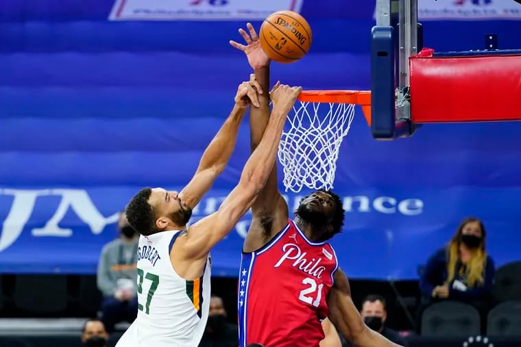 Joel Embiid blocking Rudy Gobert's shot during the second half of the Sixers' overtime win against the Jazz on Wednesday.