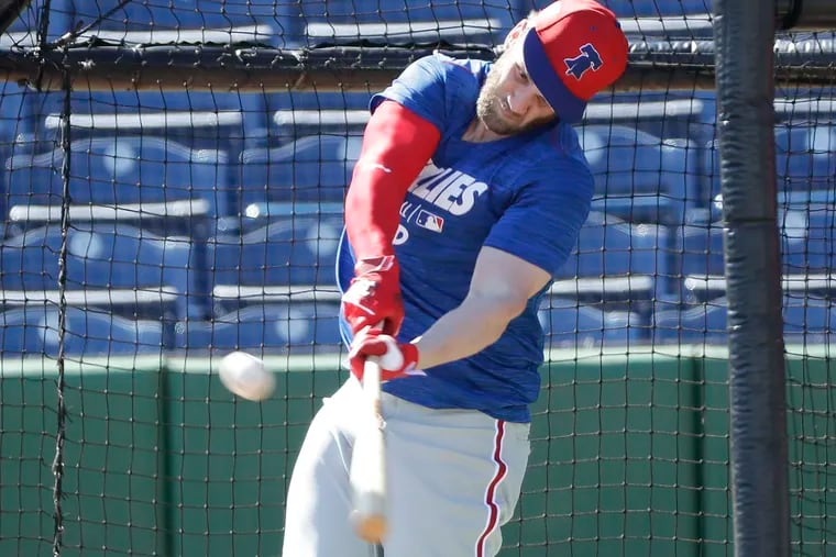 Philadelphia Phillies' Bryce Harper hits a baseball during batting practice Sunday, March 3, 2019, at Spectrum Field in Clearwater, Fla. (Yong Kim/The Philadelphia Inquirer via AP)