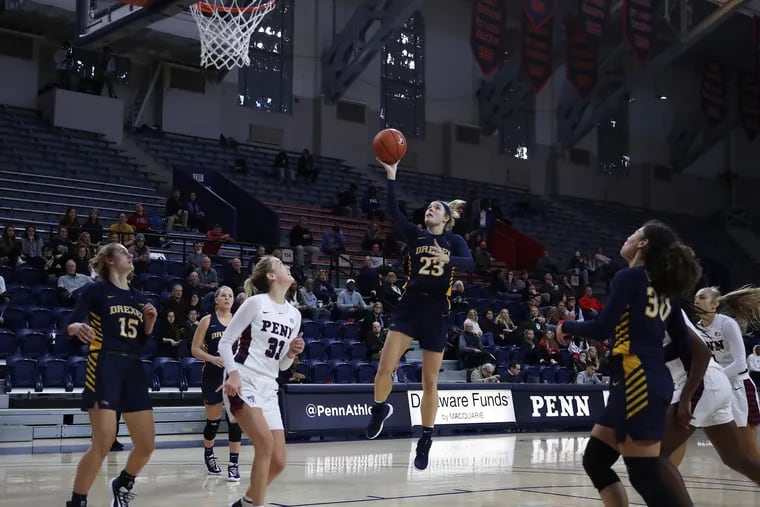 Drexel's Bailey Greenberg dribbles down the middle  and goes up for a shot against Penn on Dec. 20.