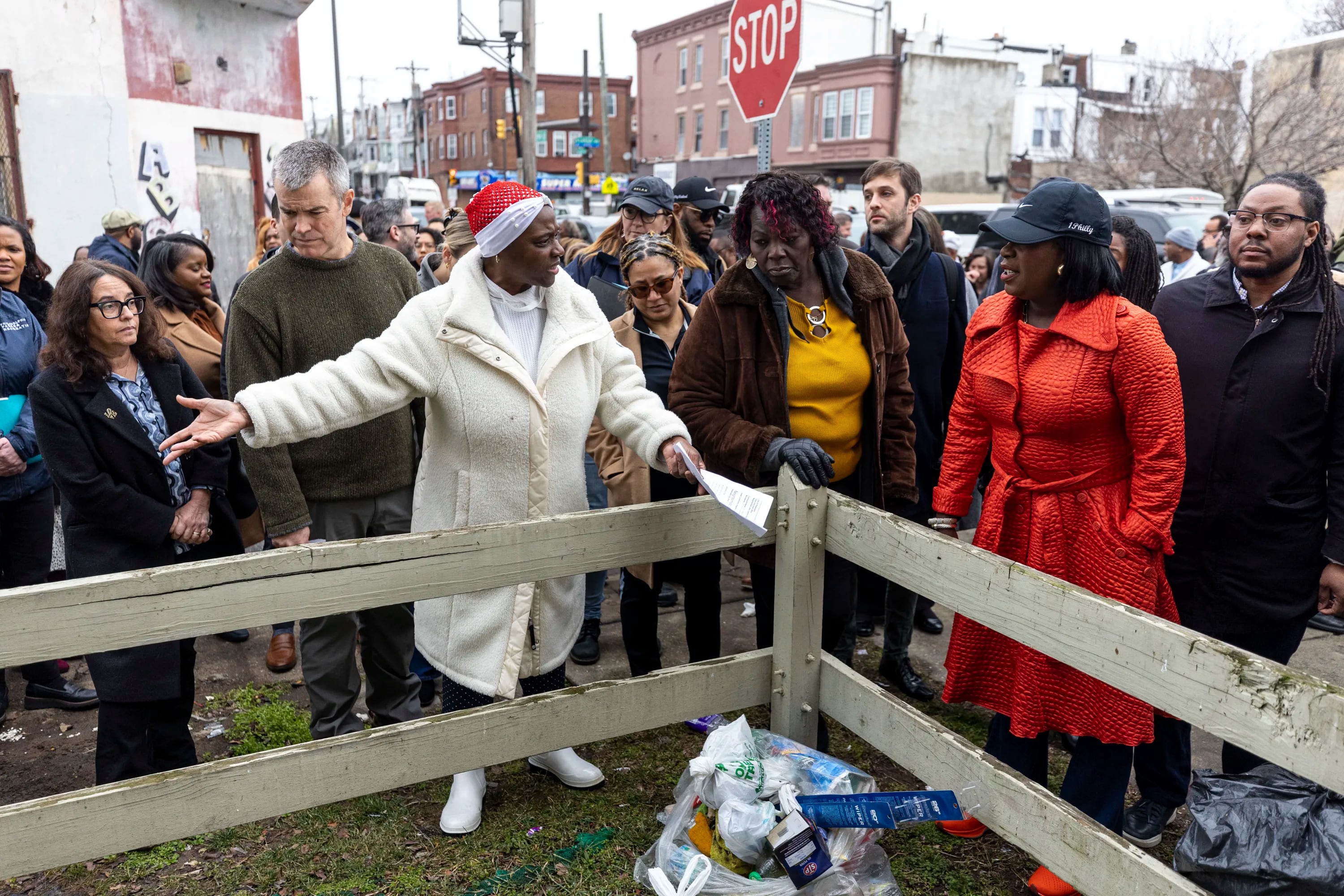 Bonita Cummings, Head of Strawberry Mansion Community Concern, points out illegal dumping and litter seen across 29th Street to Mayor Cherelle L. Parker during a tour of Strawberry Mansion in February.