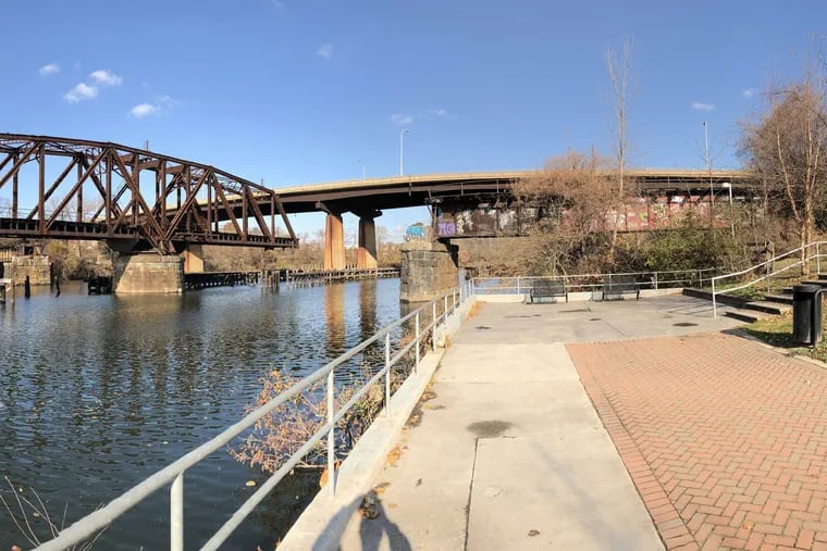 The Grays Ferry Avenue Bridge, undergoing repairs and rehabilitation work, is seen behind the Schuylkill River Swing Bridge. PennDot anticipates construction to be wrap up in the spring.