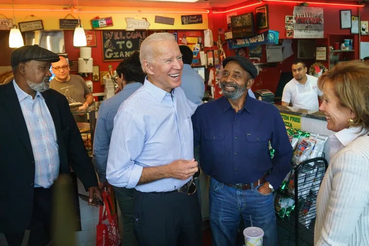 Joe Biden (second from left) greets people at Gianni's Pizza with his sister Valerie Biden Owens (far right) in Wilmington, Del., last month.