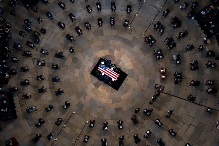 The casket of former Sen. Bob Dole, R-Kan., arrives in the Rotunda of the U.S. Capitol, where he will lie in state on Thursday.