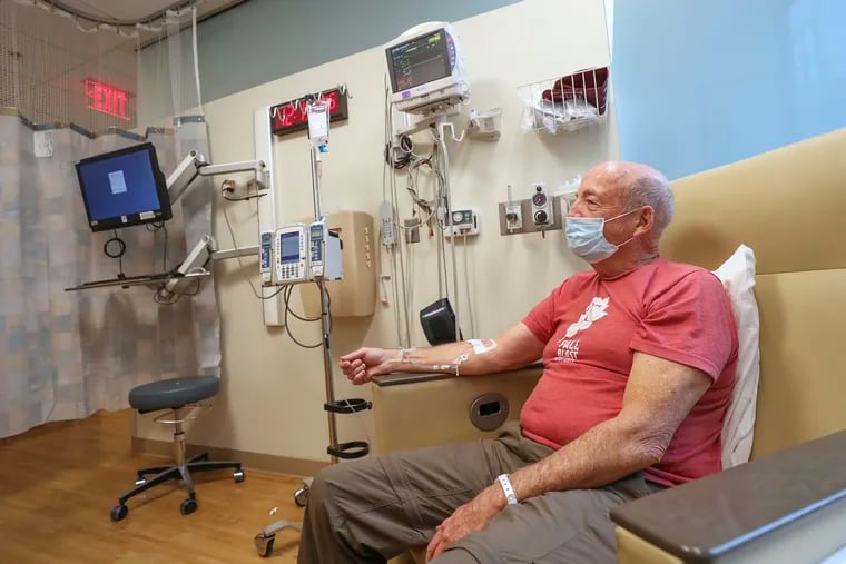 Tony Kenneff, 71, of Manheim, Pa., gets an infusion that he hopes will ward off Alzheimer's disease. He is taking part in a study at Penn Medicine, and has not been told whether he got the drug lecanemab, which was approved Friday by the FDA, or a placebo.
