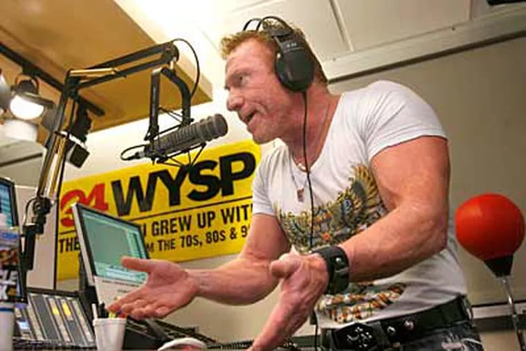Danny Bonaduce, the Broomall-born child star-turned-bad boy, came back to Philly about two months ago to host mornings on WYSP. He is shown here doing his radio program. (Charles Fox / Staff Photographer)