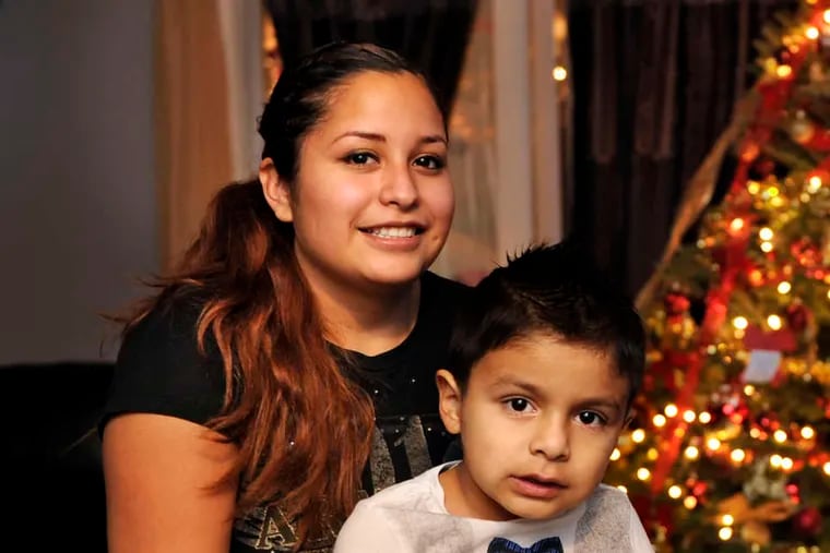 Magali Rodriguez, with her son Cristopher, 5, may study to be a paralegal.
