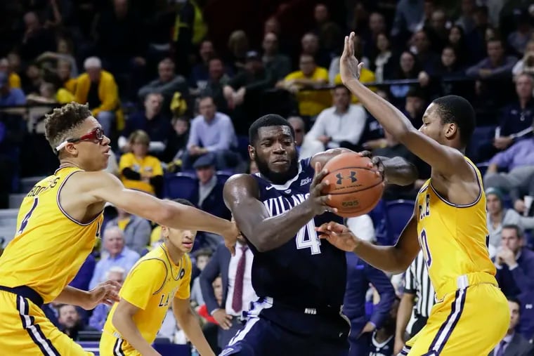 Villanova forward Eric Paschall drives to the basket against La Salle guard Isiah Deas (right) and guard Miles Brookins during the second-half at The Palestra on Saturday, December 1, 2018.