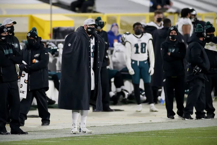Eagles quarterback Carson Wentz (11) standing on the sidelines during Sunday's game at Green Bay.