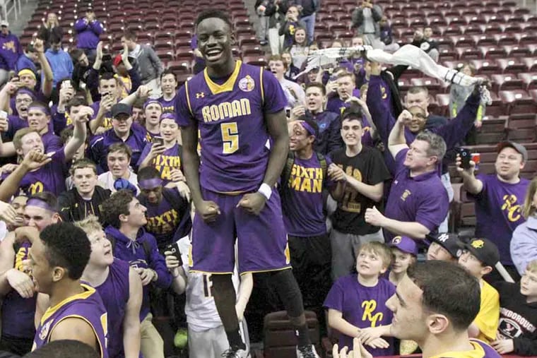 D' Andre Vilmar ( 5 ) and his team mates and fans celebrate a win over MLK. Roman Catholic vs. Martin Luther King PIAA Class AAAA Final at Giant Center in Hershey, Pa. Saturday March 21, 2015. ( DAVID SWANSON / Staff Photographer )