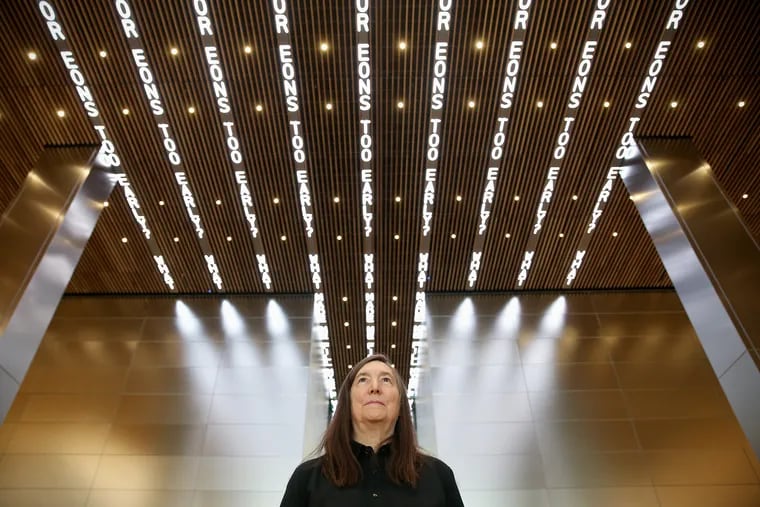 Artist Jenny Holzer stands for a portrait beneath her digital art installation "For Philadelphia" in the new Comcast Technology Center in Center City Philadelphia on Wednesday, Oct. 17, 2018. The work displays various writings on nine LED displays in the lobby ceiling.
