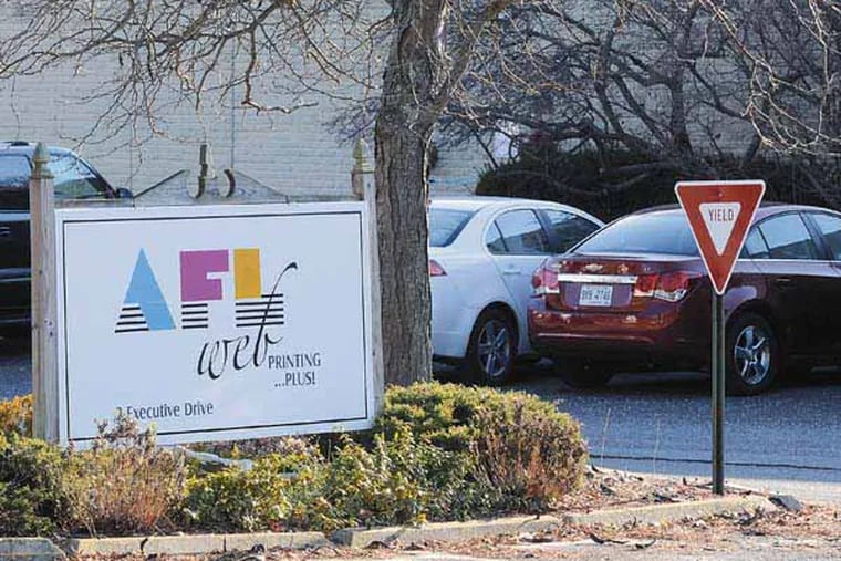AFL Web Printing in Voorhees December 5, 2012, on last day for the company which printed newspapers, guide books, and coupon books, among other publications. It was acquired tow years by a venture capital firm that said it was in for the long-term. About 200 employees are out of work. Photo made from public area across the street. ( TOM GRALISH / Staff Photographer )