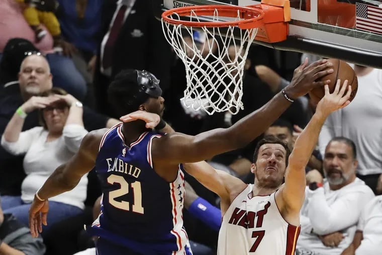 Sixers center Joel Embiid blocks Heat guard Goran Dragic’s layup attempt during the fourth quarter of the Sixers’ Game 4 win on Saturday.
