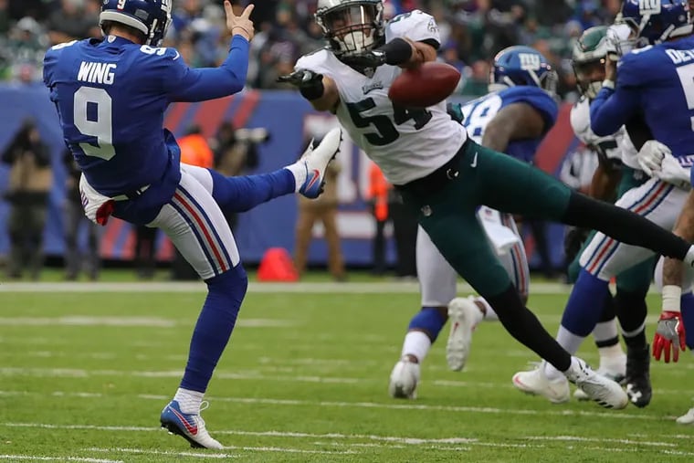 Kamu Grugier-Hill blocks a punt by the Giants' Brad Wing in the second quarter, one of key three blocks by special teams in the Eagles' Dec. 17, 2017 victory. Grugier-Hill has worked to build an important defensive role, in addition to playing special teams.