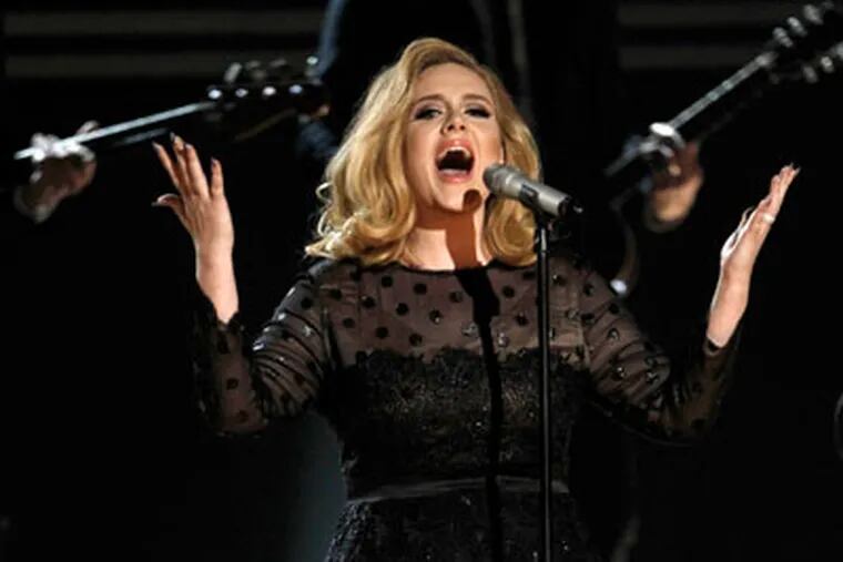 Adele performs during the 54th annual Grammy Awards on Sunday, Feb. 12, 2012 in Los Angeles. (AP Photo/Matt Sayles)