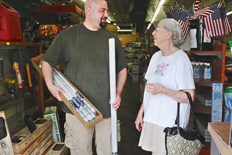 Josh Beerson of Marcus Hook Hardware still gives personal attention to local residents like Eleanor Nealy, 82, who has been coming to the store for more than 50 years. (Sharon Gekoski-Kimmel / Staff Photographer)