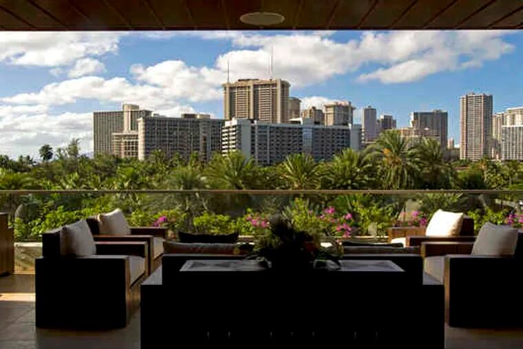 The open-air lobby bar of the new Trump International Hotel & Tower in Waikiki looks out on the green sweep of Fort DeRussy Park.