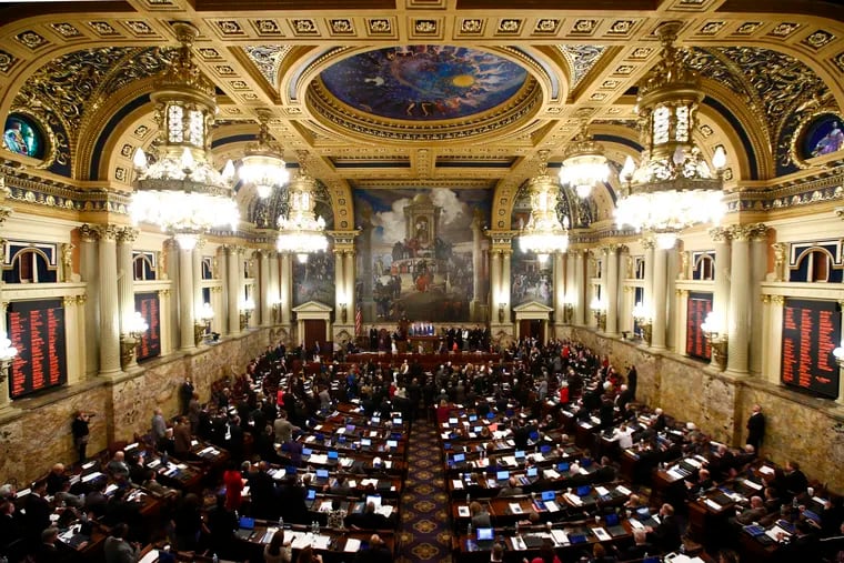 Legislators gather in the State Capitol.