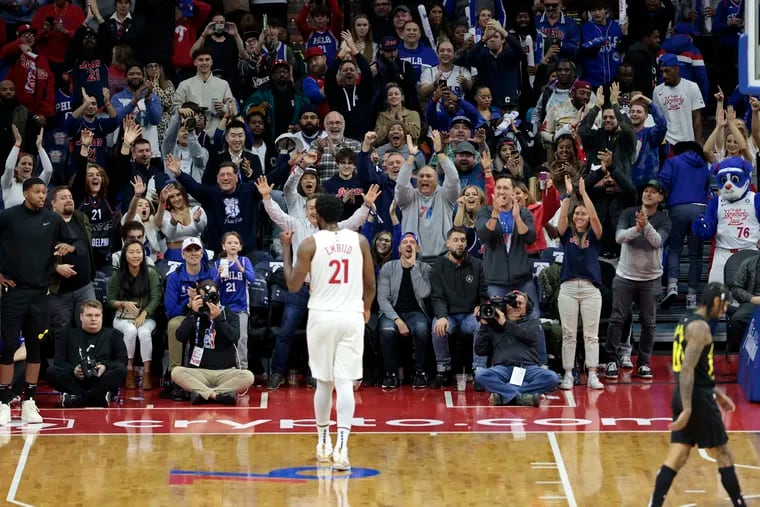 Joel Emiid hears the cheers from Sixers fans near the end of his 59-point performance against the Jazz.