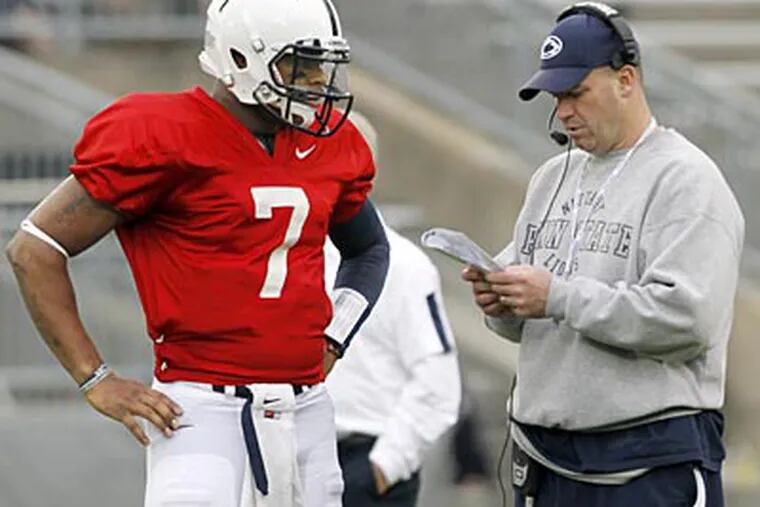 Bill O'Brien talks with quarterback Paul Jones during the Blue-White game on Saturday. (Keith Srakocic/AP)